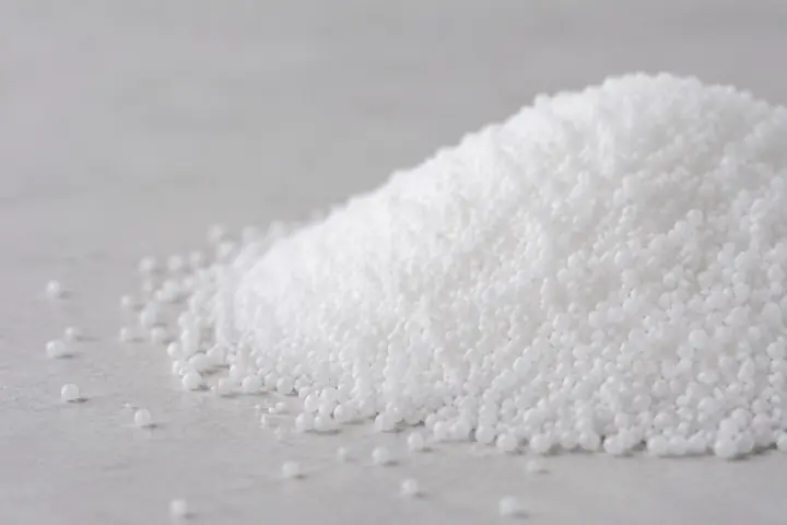 Close-up of uniform white granular urea prills