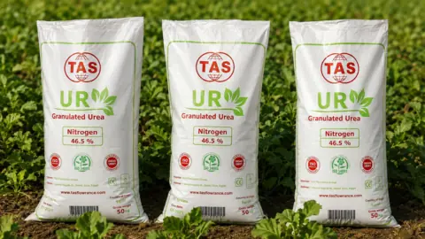 Three TAS granular urea 46 percent nitrogen bags displayed in an agricultural field