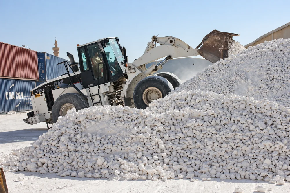 Calcium carbonate stockpile and loader for export preparation
